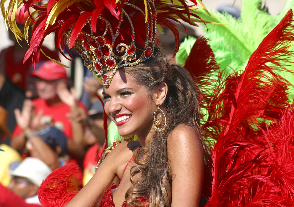  Blond Colombian woman covered in red feathers