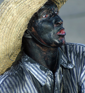 Men wearing black paint and looking ugly
