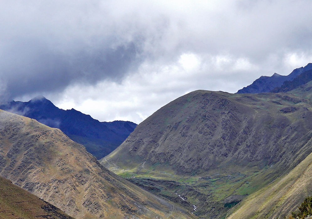 Cordillera Vilcabamba Andes Deep valleys and misty ridgelines of the Vilcabamba range stretch across rugged Andean terrain