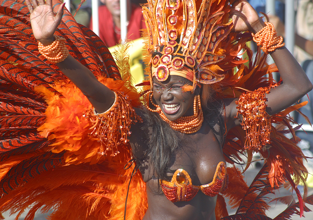Black Barranquilla Carnival dancer in orange feathers