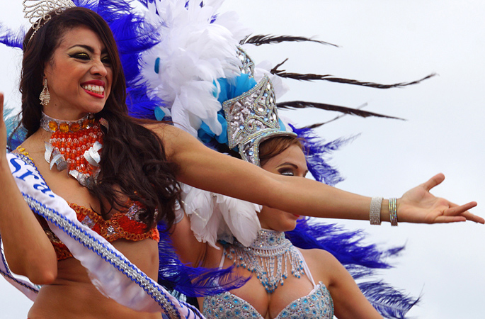 Exotic Buxom women in carnival costumes