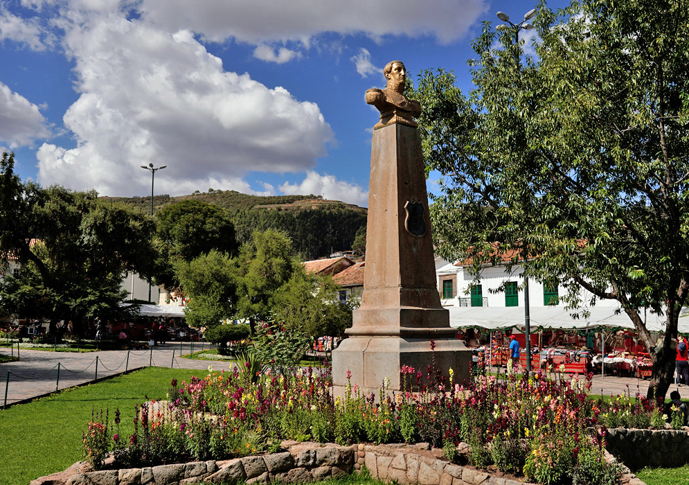 Bust of Mariscal Agustín Gamarra Statue of Mariscal Agustín Gamarra on a tall stone pedestal surrounded by flower beds in a green plaza in Cusco, Peru