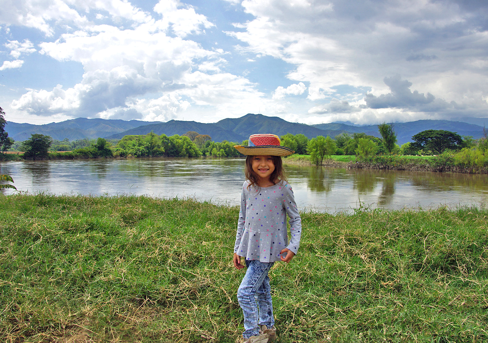 beautiful child with the Cauca river in the background