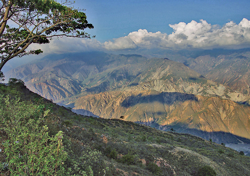 Chicamocha Mountains Colombia Rugged mountains of the Chicamocha region rise in bold layers with visible erosion lines and canyon valleys below