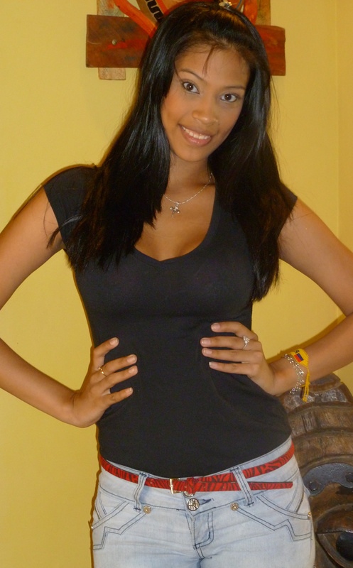 Colombian Woman Black Scoop Top Light Jeans Colombian woman wearing a black scoop top with light jeans