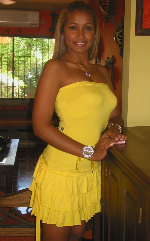 Colombian Woman Yellow Strapless Dress Colombian woman wearing a yellow strapless dress