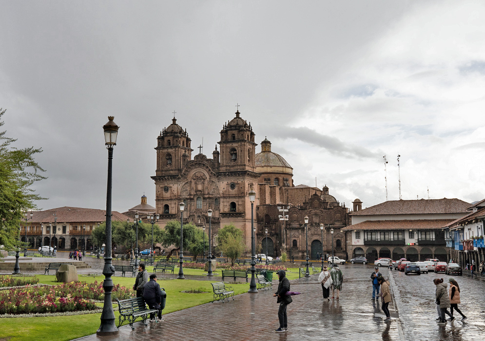 Church of the Society of Jesus in Cusco Ornate baroque façade of the Church of the Society of Jesus in Cusco, Peru, with twin bell towers and arched windows under a cloudy sky