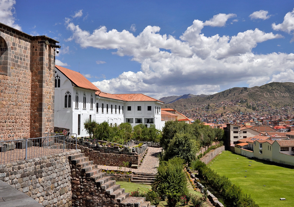 Santo Domingo Convent Peru Exterior view of the Convent of Santo Domingo in Cusco, overlooking gardens and city rooftops with mountains in the distance