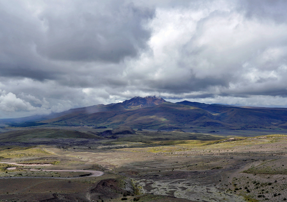 Andes Mountains Near Cotopaxi A distant view of Cotopaxi’s neighboring mountains shows a rugged, volcanic landscape beneath a moody overcast sky
