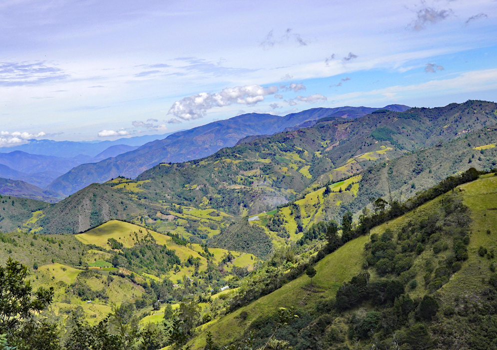 Green fields on side the of mountain ridges