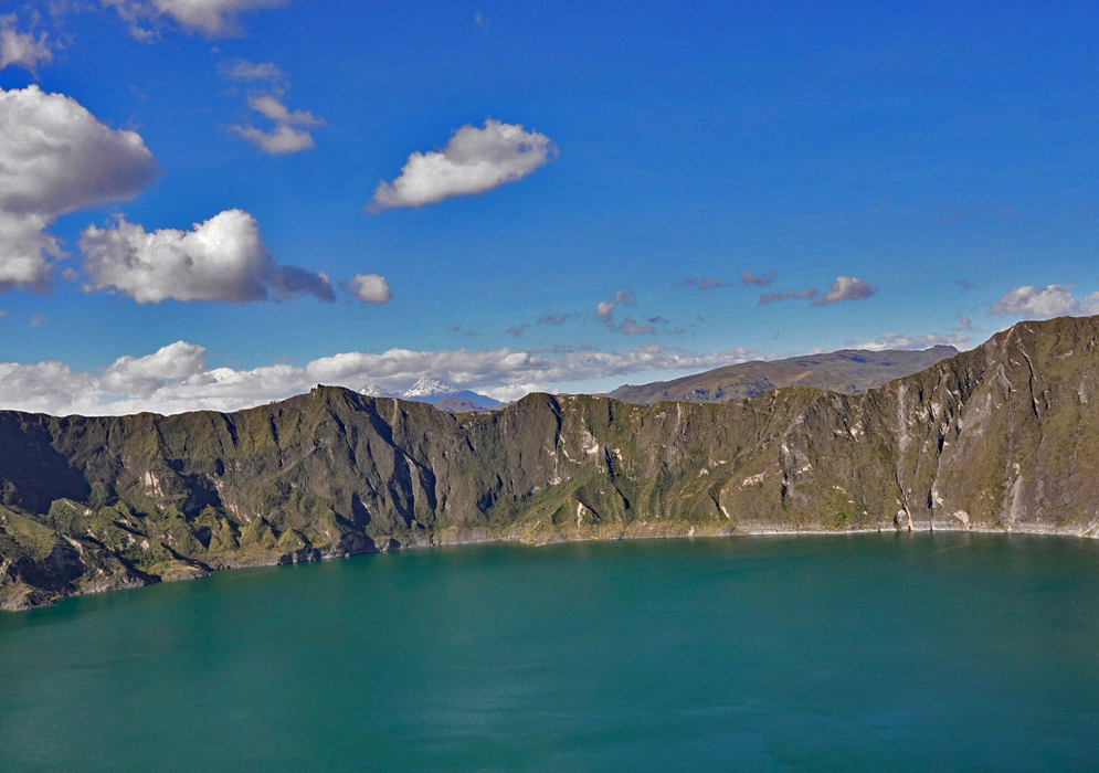 Quilotoa Crater Lake The color-rich waters of Quilotoa Lake contrasting with light brown crater slopes and sparse highland vegetation