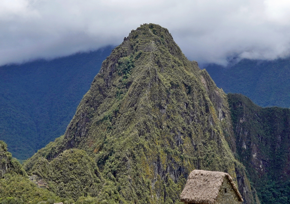 Huayna Picchu The steep, rugged peak of Huayna Picchu towers above the cloud-covered Andean valley near Machu Picchu
