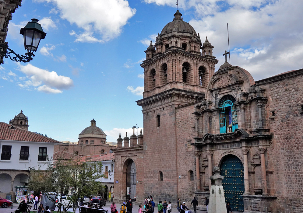 Iglesia de La Merced Cusco Historic Iglesia de La Merced in Cusco with its arched doorway, bell tower, and colonial architecture under a blue sky