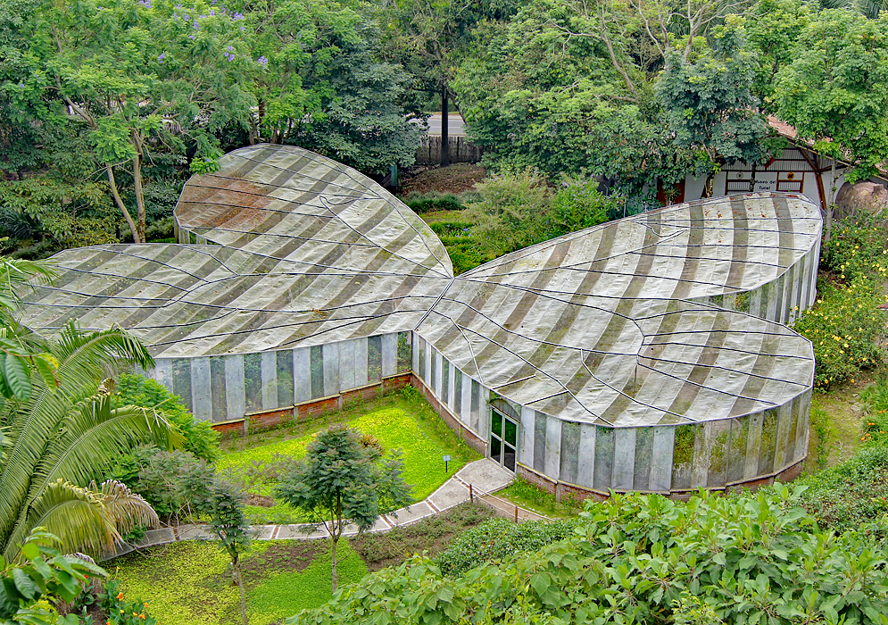 Cloudy day, butterfly shaped greenhouse at the botanical garden in Quindio, Colombia