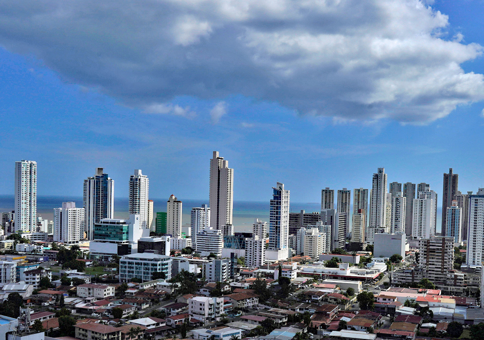 Panama City High-Rise Skyline Close view of Panama City’s densely packed modern skyline with tall towers overlooking the Pacific Ocean under a partly cloudy afternoon sky