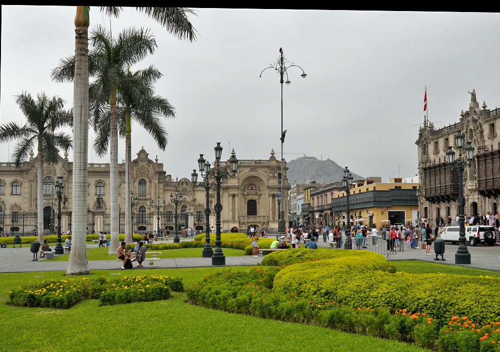 Plaza mayor lima Panoramic shot of the Plaza Mayor in Lima, highlighting the palm-lined square and the Government Palace surrounded by people and gardens