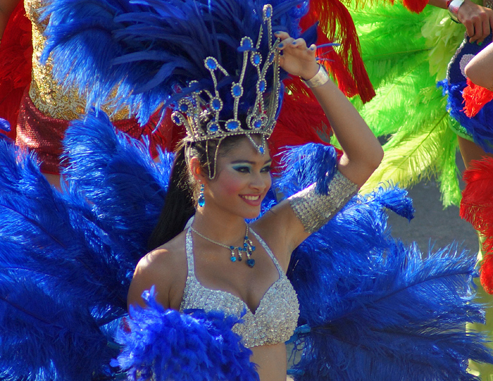 Carnival women waving to the crowd