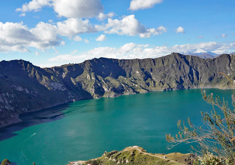 Quilotoa Lake Caldera Wide panoramic shot of Quilotoa Lake filling a collapsed volcanic crater with emerald waters and steep rock walls