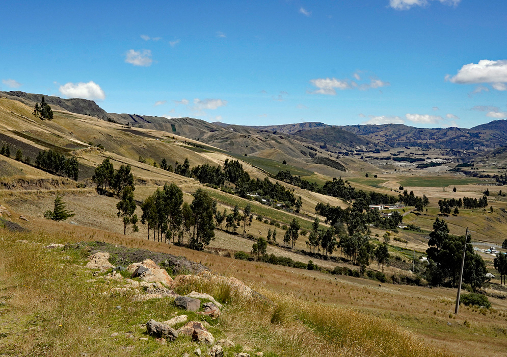 Highland Farming Near Parish Ecuador Lush green slopes and cultivated highland plots surround a sharp-edged hilltop in Ecuador’s Andes