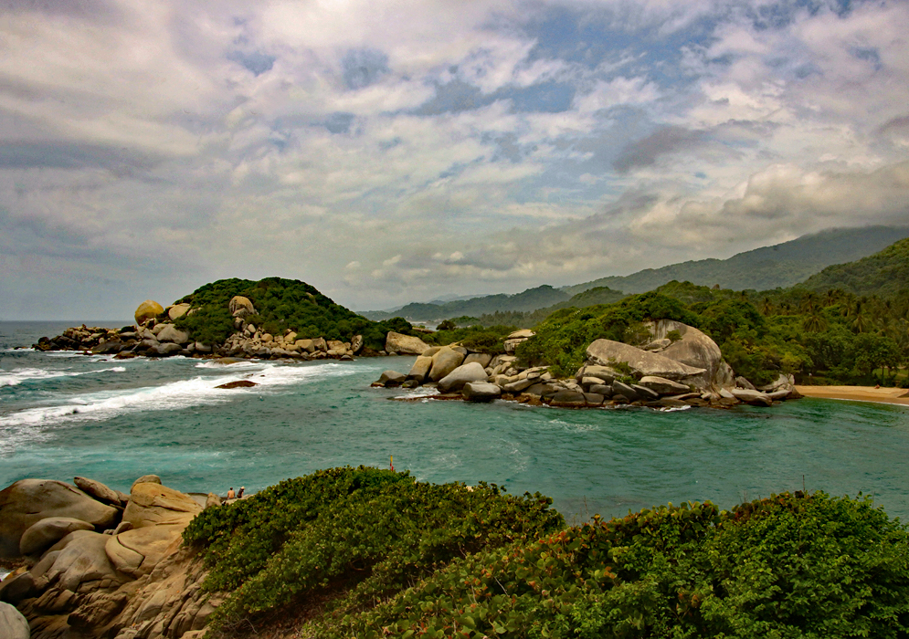 Tayrona National Park looking east from Cabo towards the mountains, jungle and shoreline during overcast skies