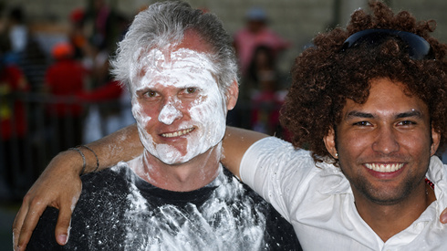 The make-up of flour was courtesy of a woman sitting behind me who unexpectedly put her hands all over my face, so I could blend with the crowd. This was a year that they prohibited foam so water and flour was thrown