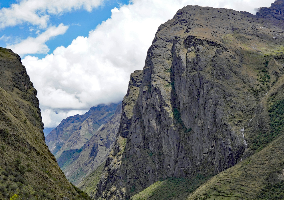 Vilcanota Mountain Cliffs Peru Towering vertical rock cliffs and dramatic ridgelines dominate the high mountain corridor of the Vilcanota region in Peru